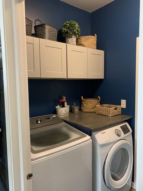 Top load washing machine, but with front load dryer. Stock cabinets and wood stained counter. Wanted a counter, but hate the front loading washing machine. Counter Over Dryer Only, Top Open Washing Machine Laundry Room, Top Load Washing Machine Cabinet, Top Of Dryer Organization, Laundry Room With Top Load Washer, Top Load Washing Machine Area Ideas, Top Load Laundry Room, Top Load Washer Laundry Room Ideas, Washing Machine Area Ideas