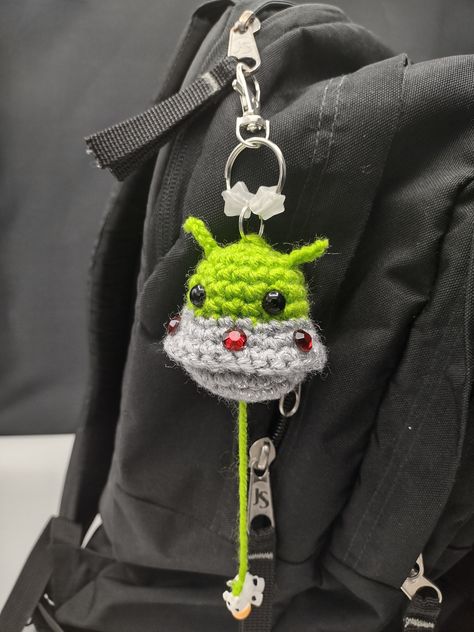 This little guy is a great attention getter and conversation starter! Very unique and funny! Crochet Glow In The Dark Patterns, Weird Things To Crochet, Alien Abducting Cow, Crochet Ideas Keychain, Glow In The Dark Crochet, Cool Gifts For Guys, Space Crochet, Crochet Alien, Alien Crochet