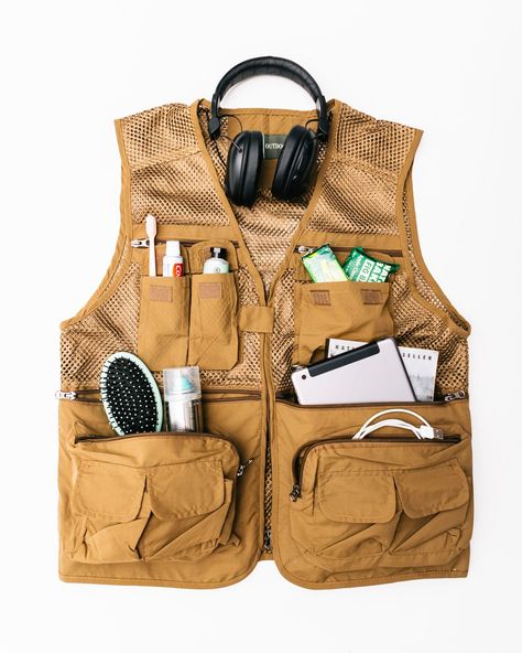 Hate Baggage Fees? Wear a Fishing Vest on the Plane - WSJ Fishing Vest Outfit, Vest Styling, Fishing Clothes, Cheap Vacations, Travel Vest, Fishing Vest, Utility Vest, On The Plane, Wardrobe Update