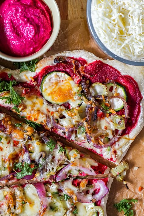 The perfect late summer/early fall pizza with beet pesto, caramelized onion, fennel, zucchini, and cheese! This healthy vegetarian pizza is a nice change from the classic tomato sauce and cheese pairing. Beet Pesto Pizza, Beet Pizza, Zucchini And Cheese, Cream Cheese Pizza, Beet Pesto, Fall Pizza, Flatbread Pizzas, Squash Pizza, Veg Meals