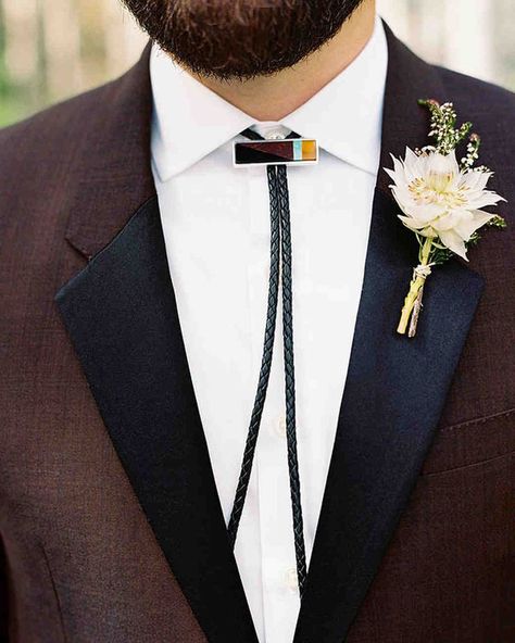 A Bohemian Wedding in Telluride, Colorado | Martha Stewart Weddings - "I'm not much of a tie guy," says the groom of his custom Lizzie Fortunato bolo, which he paired with a burgundy Burberry suit. "The Western-cowboy thing was fun." Wedding Bolo Tie Grooms, Blazer Accessories, Bolo Tie Wedding, Ranch Elopement, Burberry Suit, Groomsmen Style, Tie Ideas, Suits Groom, Wedding Tux