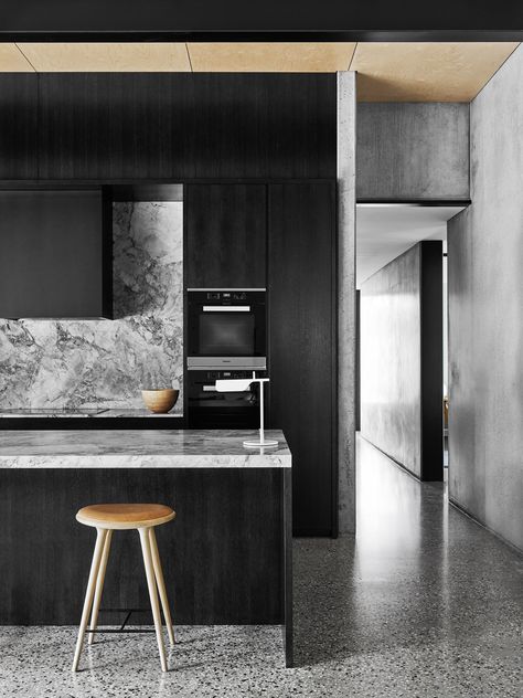 Sophisticated yet relaxed, this kitchen has 3.6-metre-high ceilings and, although large, it is far from overpowering. Its rich, moody tones have been achieved with American oak and chunky ‘White Fantasy’ marble. [See more from this house here](http://www.homestolove.com.au/level-best-2642|target="_blank"). Photo: Brooke Holm | *Belle*: [object Object] Flack Studio, Black And White Kitchen, Plywood Interior, Dark Kitchen, Grey Kitchen, Australian Homes, Counter Tops, Black Kitchens, Residential Design