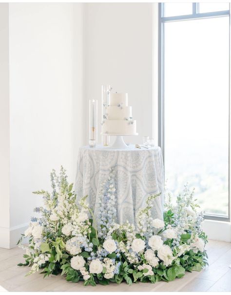 White Florals With Blue Accents, Summer Wedding White Flowers, Blue And White Floral Wedding Cake, Dusty Blue Cake Table, White Wedding Cake White Flowers, Powder Blue Theme Wedding, White Wedding Flowers With Pop Of Blue, Blue And White Wedding Theme Decor, Blue White And Green Wedding Flowers