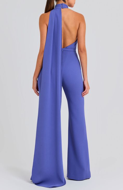 An open back and a halter neck bring flirty appeal to this wide-leg jumpsuit with a drapey detail that flows down the back of this belted jumpsuit. 63 1/2" center front length; 34 1/2" inseam; 26" leg opening (size 8) Hidden back zip; keyhole with button-and-loop closure Halter neck Sleeveless, with cutaway shoulders Removable belt Stretch lining 100% polyester Dry clean or hand wash, dry flat Imported Classy Jumpsuit Outfits, Fancy Jumpsuit, Nadine Merabi, Black Lace Jumpsuit, Jumpsuit For Wedding Guest, Classy Jumpsuit, Halter Neck Jumpsuit, Formal Jumpsuit, Belted Jumpsuit