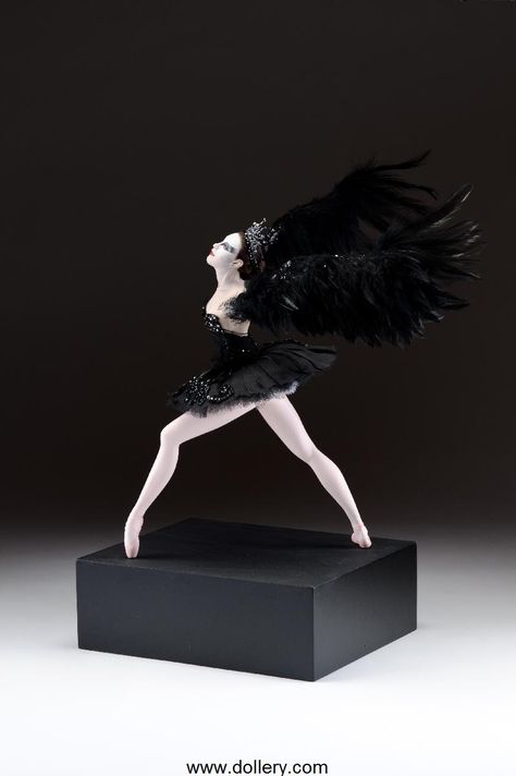 Vickie Arentz - "Black Swan" It's a 17" (43cm) tall figure on a 4" (10cm) tall base making the entire piece 21" (53cm) tall by 20" (51cm) wide. Polymer clay figure sculpted in one piece with detachable real feather wings. Hand painted eyes, viscous fiber wig, costume of leather, cotton voile and silk with hand beaded details and Swarovski crystals. Black Swan Costume, 22nd Anniversary, Ballet Doll, Fun Office, Ballet Beauty, Spooky Party, Sculpted Doll, Ballerina Doll, Heavy Lifting