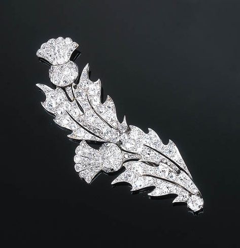 A Diamond Thistle Brooch   Of slightly scrolled openwork design, each stylised thistle set throughout with old-cut diamonds, circa 1910, one small diamond deficient, 8.0 cm long Thistle Brooch, Scottish Jewellery, Edwardian Jewelry, Gem Diamonds, Unusual Jewelry, Precious Jewels, Retro Jewelry, Celtic Jewelry, Crown Jewels