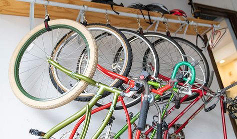 How to Store Bikes in the Garage to Create More Space Best Way To Store Bikes In Garage, Garage Storage Bikes, Storing Bikes In Garage, Bikes In Garage, Bike Storage Garage, Bike Hooks, Bike Storage Rack, Bike Store, Handyman Services