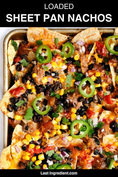 Topped with black beans, refried beans, corn, red onions and tomatoes, these sheet pan nachos can be kept vegetarian, or you can add shredded rotisserie chicken or taco-seasoned ground beef. They are perfect for football snacks whether that’s on Super Bowl Sunday or any other occasion when you’re looking for a simple sharable appetizer. Seasonal Dinner Recipes, Vegetarian Side Dish Recipes, Sheet Pan Nachos, Pan Nachos, Shredded Rotisserie Chicken, Vegetarian Nachos, Vegetarian Appetizer, Onions And Tomatoes, Football Snacks