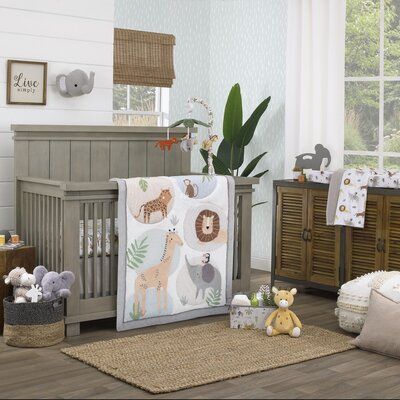 The Jungle Trails Photo Op Crib Sheet features a variety of jungle critters - a playful elephant, happy giraffe, loveable lion, and sweet cheetah, all surrounded by green botanical leaves and the words "Stay Wild". The soft 100% cotton sheet and features fully enclosed elastic edges for a secure fit. This crib sheet is the perfect backdrop for a variety of photo ops of your baby! | Indigo Safari Jungle Trails White, Green, And Gold Stay Wild Animal Print w/ Leaves Photo Op 100% Cotton Nursery Fi Playful Animals, Room Boy, Boy Rooms, Bright White Background, Botanical Leaves, Crib Skirt, Toddler Mattress, Fleece Baby Blankets, Crib Skirts