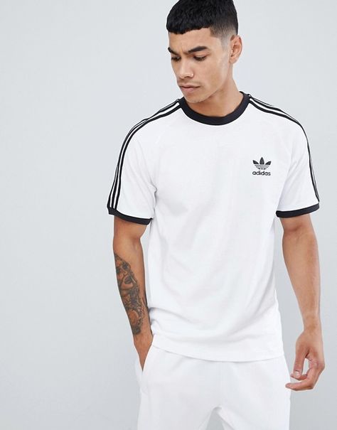 adidas Originals adicolor california t-shirt in white cw1203 | ASOS Adidas Tshirt Outfit, Addidas Shirts, Adidas Outfit Men, Looks Adidas, Adidas Sweat, Adidas Originals Logo, 70s T Shirts, Adidas Tshirt, Sweat Suits