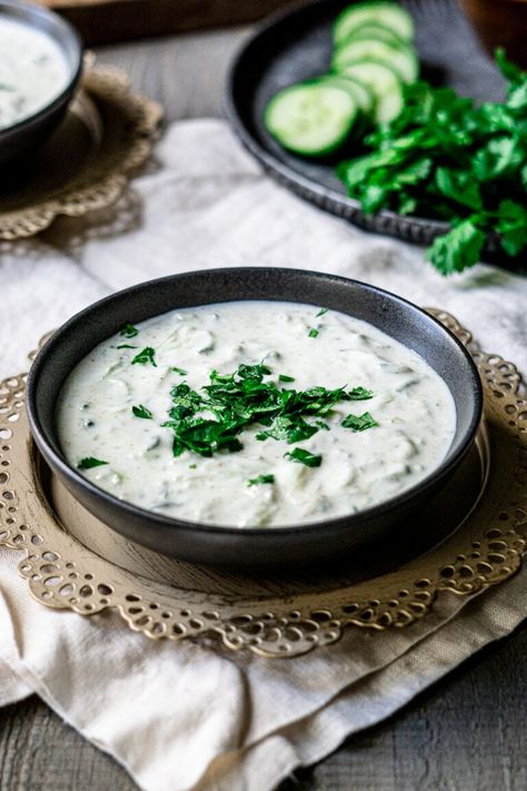 A cooling Indian yogurt-based dip that is the perfect balance to your spicy dishes. This easy cucumber raita makes a refreshing side to your Indian meal or snack! #cucumberraita #raita #indianfood Indian Yogurt Sauce, Cucumber Raita Recipe, Vegetable Samosa, Raita Recipe, Peanut Curry, Cilantro Chutney, Cucumber Raita, Cucumber Yogurt, Indian Meal