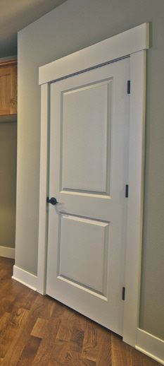 Carrara 2 panel door with Standard Farmhouse Trim 1x Trim Ideas, Interior Door Trim Craftsman, Modern Farmhouse Door And Window Trim, Farmhouse Trim Around Doors, Thick Door Trim, Craftsman Door Casing Ideas, Simple Trim And Baseboards Farmhouse, Interior Door Trim Styles, Farmhouse Doors And Trim