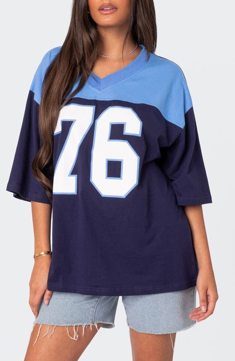 Your favorite year, your team number or your lucky number—keep 'em all guessing when you slip into the oversized jersey-inspired T-shirt made from soft cotton. V-neck Elbow-length sleeves 100% cotton Machine wash, dry flat Imported Football Girl, Oversized Jersey, Grunge Streetwear, Jersey Outfit, Streetwear Aesthetic, T Shirt Oversized, Basic T Shirt, Oversized T Shirt, Football Jersey