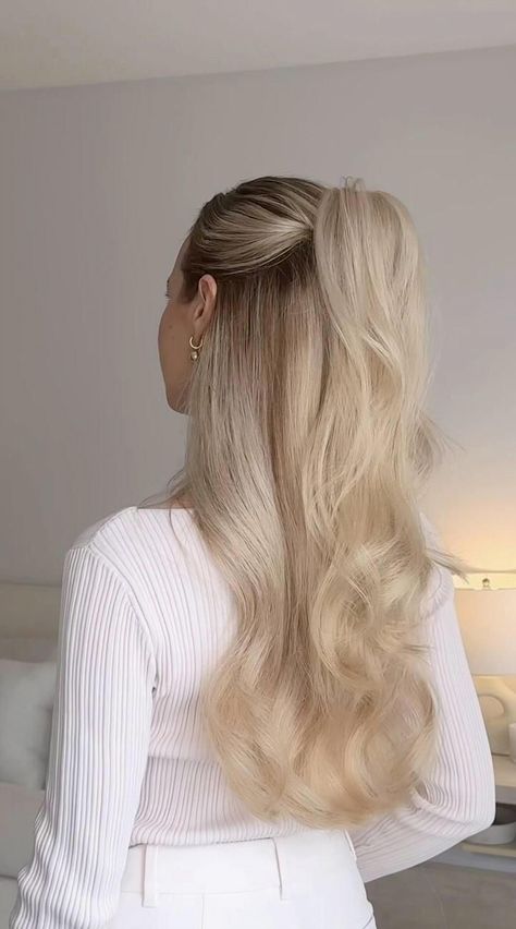 Try out this simple half-up hairstyle, taking a cue from Ariana Grande. Perfect for those looking for hair inspiration and easy styling ideas. Ideal for long hair, this half-up, half-down look is both chic and effortless. Check out the tutorial for a fresh twist on your everyday style.