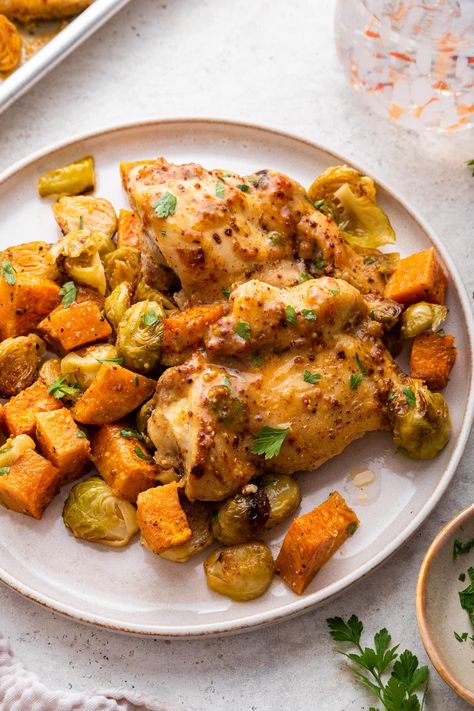 This honey mustard chicken sheet pan meal is the perfect quick and easy recipe for busy weeknights. It combines tender chicken thighs with veggies all tossed in a flavorful honey mustard sauce. Brussels Sprouts And Sweet Potatoes, Chicken Sheet Pan, Honey Mustard Chicken, Pan Dinners, Honey Mustard Sauce, Mustard Chicken, Mustard Sauce, Pan Chicken, Tender Chicken