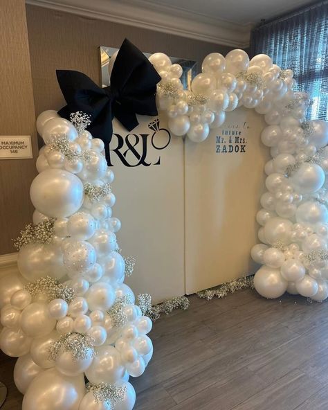 Celebrate your love with elegance! ✨ Our stunning white wedding decor, adorned with delicate gypsophila flowers, creates a gentle and romantic atmosphere. The perfect backdrop for saying ‘Cheers to the Future Mr. & Mrs.!’ 💍🌸 #WeddingDecor #MrAndMrs #ElegantWeddings #Gypsophila #LoveInBloom #CheersToLove Black And White Balloon Garland, Garland With White Flowers, Entrance Backdrop, Comic Christmas, White Balloon Garland, White Wedding Decor, Black And White Balloons, Dark Wedding Theme, Christmas Comics