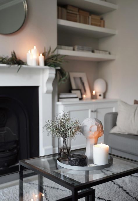 My minimalist Christmas decor - the first few touches | These Four Walls Neutral Grey Living Room, Fireplace Display, Minimalist Fireplace, Xmas Fireplace, Grey Living Room, Victorian Renovation, Minimalist Christmas Decor, Pumpkin Display, White Pillar Candles