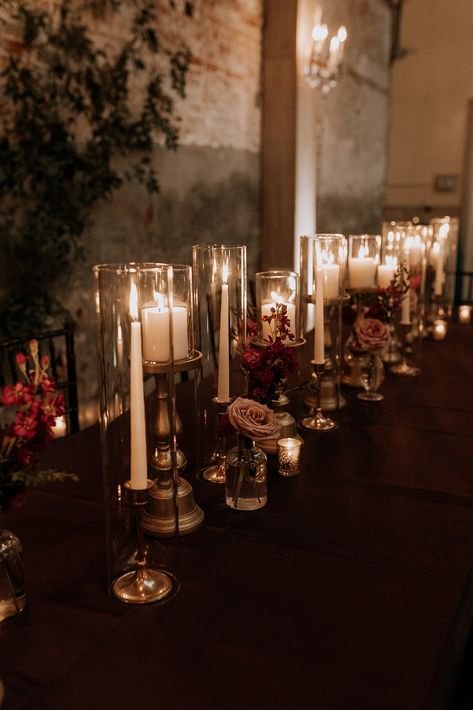 Moody, sexy, and dreamy? Yup, we can do that! Allow us to elevate your wedding to a new level of elegance with our expert eye and your unique style. 🖤⁠ Moody Table Decor Wedding, Dark Candle Centerpieces Wedding, Dark And Dreamy Wedding, Moody May Wedding, Moody Romantic Wedding Aesthetic, Moody Wedding Decor Table Settings, Small Moody Wedding, Moody Romance Aesthetic, Wedding Table Flowers Small Vases