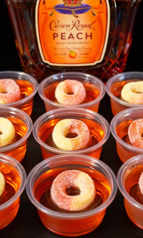 These easy peach jello shots are made with Peach Crown and peach gummy rings. Perfect for pre-gaming and girl's night! Peach Ring Shots, Wedding Jello Shots Ideas, Bridal Jello Shots, Pre Game Drinks Alcohol, Peach Bellini Jello Shots, Crown Vanilla Jello Shots, Crown Royal Peach Jello Shots, Peach Ring Shot, Crown Peach Jello Shots