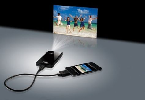 The size of a cell phone, the projector connects directly to your iPod, iPhone or iPad (or, with an adapter, to a laptop or digital camera). Iphone Projector, Gadgets Techniques, Gadget Tecnologici, Phone Projector, Teknologi Gadget, Fotografi Digital, Portable Projector, Tech Toys, Gadgets And Gizmos