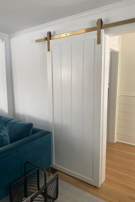 Mesh Barn Door, Barn Door Wainscoting, Shiplap Barn Door, Medium Wood Floors, Door In Living Room, Living Room With White Walls, Cream And Grey Bedroom, Shiplap Room, Shiplap Door