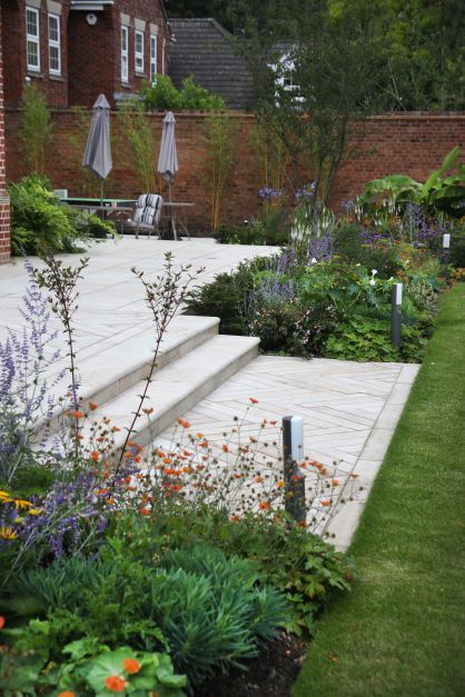 Our range of stone steps provide durability with beautiful aesthetics and are available in a range of natural stone including sandstone, granite and slate. Click the link to view our full range. Garden Patio With Steps, Porcelain Steps Garden, Patio With Steps Down To Garden, Patio Steps Down To Garden, Steps Down To Garden, Patio With Steps, Natural Stone Patio, Bluestone Steps, Cream Garden