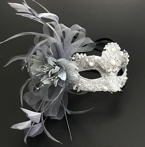 Masquerade mask in silver. Simplistic for woman with a gray floral- destined to pop out at any event, wedding etc This masquerade mask is great for any occasion. Mascarade Mask Ideas, Masquarede Ball Masks, Mascarade Mask Women, Masked Ball Aesthetic, Mascarade Ball Dresses, Gray Mask Masquerade, Masquerade Party Outfit Women, Masquerade Mask Ideas, Mascarade Mask Women Silver