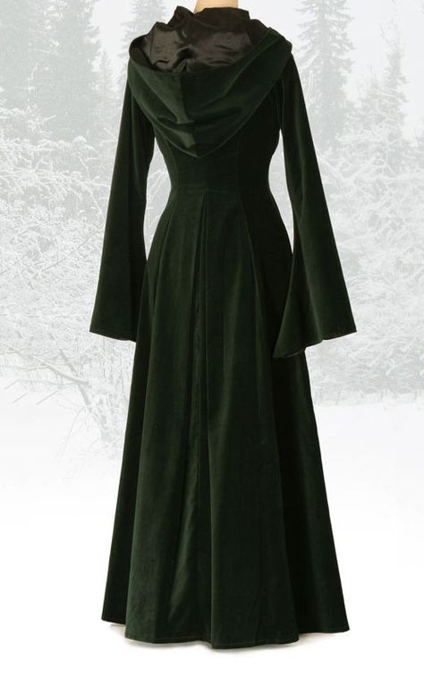 The magical Beltane coat is made from a rich forest green cotton velvet. The coat is beautifully tailored to the upper body and fits into the waist with a deep pleat at the back. It skims the hips and drops into sweeping drapes at the hem. The coat is fully lined in black satin and features a deep hood and a drop trumpet style sleeve. The front fastens with six ornate antiqued brass buttons.  Made to measure and custom options are available.  This design is made to order, please allow up to s... Mode Mantel, Medieval Dress, Beltane, Mode Inspo, Bohemian Clothes, Green Velvet, Cloak, Womens Fashion Trends, Larp