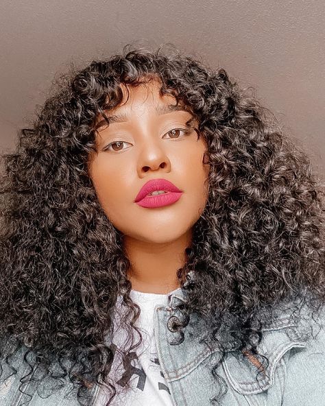 Black girl with curly hair and bangs and pink lipstick-golden hour sunlight Deep Wave With Bangs, Curly Wig With Bangs, Deep Wave Wig, Air Bangs, Affordable Wigs, Hair With Bangs, Wave Wig, Curly Hair With Bangs, Wig With Bangs