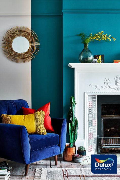 Opulent Teal Lux paired with a warm neutral will create an inviting reading corner.  #Teal #ColourTrends #Fireplace #FeatureWall Teal Walls Living Room, Teal Living Room Decor, Teal Accent Walls, Teal Rooms, Teal Living Rooms, Feature Wall Living Room, Living Room Warm, Teal Walls, Living Room Color Schemes