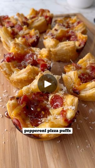 25K views · 4.9K reactions | Pepperoni pizza puff pastry cups 🍕

Crunchy, flaky and delicious puff pastry filled with homemade garlic butter, mozzarella, ricotta, pepperoni and topped with homemade hot honey 🤤 These would make a perfect app for Super Bowl! 🏈 Recipe below

1 sheet puff pastry, thawed
9 tsp Marinara or pizza sauce 
Shredded mozzarella cheese
9 tsp Ricotta cheese
Mini pepperoni cups
Parmesan cheese
Hot honey

Garlic butter
3 tbs softened butter 
1 garlic glove
1 tsp parsley 

Preheat oven to 375. Cut your puff pastry into 9 sheets. Spray a muffin tin with cooking spray and place one sheet in each tin. Make your garlic butter by combining butter, garlic and parsley. Brush the bottom of each puff pastry with garlic butter. Top with 1 tsp marinara sauce, pinch of shredded moz Pizza Puffs Recipe, Pepperoni Cups, Pizza Puff Pastry, Homemade Hot Honey, Puff Pastry Cups, Pepperoni Pizza Puffs, Pastry Cups, Puff Pastry Pizza, Pastry Pizza