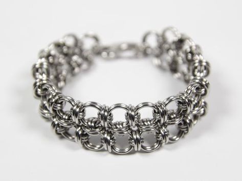 A made to size chainmaille bracelet with an Orbit Loop weave. This bracelet is suitable for both men and women. The jump rings and lobster clasp are made of stainless steel.The rings are 17swg (1.4mm) and 18swg (1.2mm) thick. The bracelet is 13/16" (20mm) wide.Just add the desired inner circumference of the bracelet or your wrist circumference to your order. You can measure your wrist with an actual tape measure or with a printable tape measure that I can provide.Also have a look at my other cha Chainmaille Ring, Chainmail Ring, Wooden Teething Ring, Chainmail Bracelet, Chainmaille Bracelet, Bracelet Mens, Jewelry Business, Stainless Steel Rings, Tape Measure