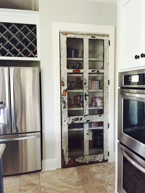 100+ year old cypress screen door with original chicken wire sanded gently and clear coated. Used as a pantry door. Pantry Screen Door Ideas, Chicken Wire Pantry Door, Pantry Screen Door, Antique Screen Door, Screen Door Pantry, Chicken Wire Door, Rustic Pantry Door, Rustic Pantry, Vintage Pantry