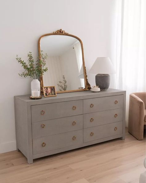 Mirrored Dresser Decor, Vintage Gold Mirror Bedroom, How To Decorate Dresser With Mirror, White Dresser Gold Mirror, Vintage Mirror Over Dresser, Grey And Gold Furniture, Grey Dresser Bedroom Ideas, Gold Mirror Dresser, Brass Bedroom Decor