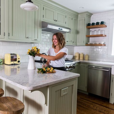 Bungalow kitchen gets modern with sage green cabinets, dark wood floors, and bright white subway tile backsplash Vintage Green Cabinets, Sage Green Beadboard Kitchen, Olive Green Kitchen Cabinets Gold Hardware, Sage Green Kitchen Cabinets With Granite, Kitchens With Sage Green Cabinets, Small Kitchen Green Cabinets, Sage Green Small Kitchen, Kitchen With Sage Green Cabinets, Sage Green Cabinets Kitchen