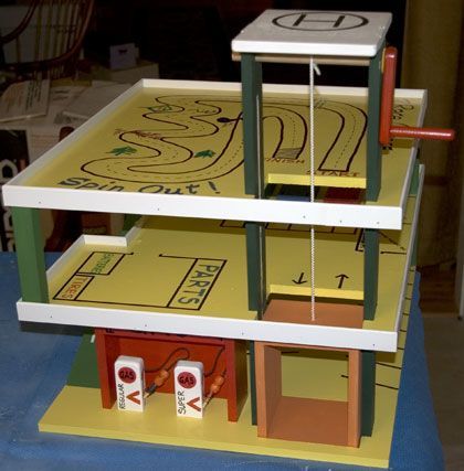 The RunnerDuck Parking Garage plan, is a step by step instructions on how to build a parking garage for kids. Wooden Toy Garage, Toy Car Garage, Toy Garage, Wooden Garage, Garage Plan, Woodworking For Kids, Garage Plans, Parking Garage, Cardboard Crafts