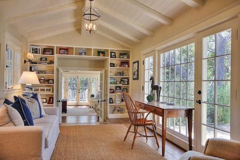 Sunroom Hallway, Sunroom Built In Bookcase, Sunroom Vaulted Ceiling, 10ft Ceiling Living Room, Sunroom Addition Off Living Room French Doors, Exposed Brick Sunroom, Vaulted Ceiling Sunroom Exposed Beams, Wall Of Windows Living Room, Sunroom Addition Off Living Room