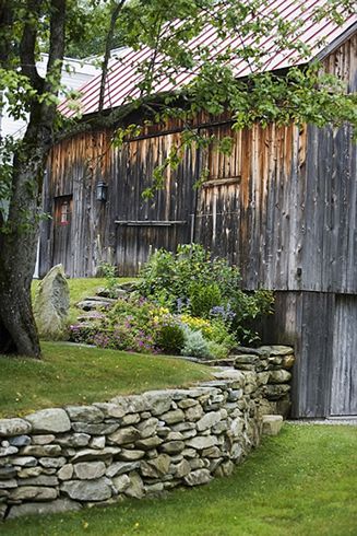 Old Country Barn + Great stacked stone retaining wall..except for the snakes. Stone Wall For Garden, Stone Garden Fence, Barnstone Retaining Wall, Backyard Patio Retaining Wall, Stone Wall In Front Of House, Old Stone Wall Garden, Rock Walls Landscaping, Stone Wall Backyard, Stone Terrace Garden