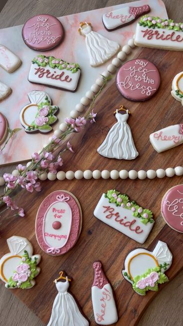 Sugar & Spice Cookie Co. on Instagram: "Here it is, the complete “say yes to the dress” set!! 😍🌸💗✨ This custom sugar cookie set was specially made to celebrate a wedding dress shopping trip for a new bride and her friends. I was so excited to make these and I’m so happy with how they turned out!! 💓 Wedding dress and plaque cutter: @kaleidacuts Ring cutter: @bobbiscutters Champagne bottle cutter: @mikescookiecutters #customsugarcookies #sugarcookies #sugarcookiedecorating #cookiedecorating # Baked With Love, Say Yes To The Dress, New Bride, Spice Cookies, Dress Shopping, Cookie Gifts, A Wedding Dress, Yes To The Dress, Wedding Dress Shopping