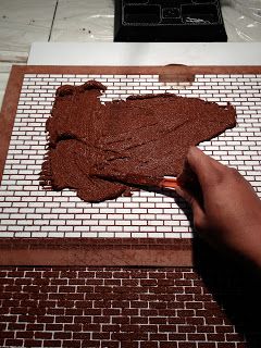 Jocelyn's Mountfield Dollhouse: Brick Exterior Using Sanded Grout and Bromley Stencils Dollhouse Farmhouse, Brick Wall Stencil, Brick Paper, Dollhouse Tutorials, Brick Exterior, Sanded Grout, Faux Brick, The Bakery, Sugar Craft