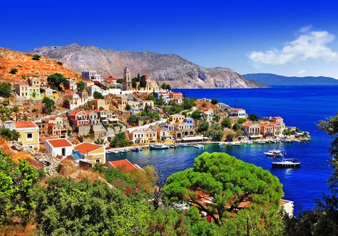 Matt Barrett's Greek Islands Guide: The Dodekanese Cheap Holidays, Greece Landscape, Greek Islands Vacation, Rhodes Island, Colorful Houses, Greece Travel Guide, Tourist Trap, Mediterranean Cuisine, Jules Verne