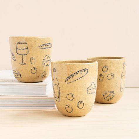 “Girl Dinner” cups by local artist @earthandherflower with hand drawn designs in underglaze pencil and a clear coat for easy cleaning. 🥖 🍷 Underglaze Pencils Ceramics, Underglaze Pencil Pottery, Underglaze Ideas, Underglaze Designs, Underglaze Pencil, Building Inspiration, Pottery Inspo, Hand Building, Pottery Inspiration