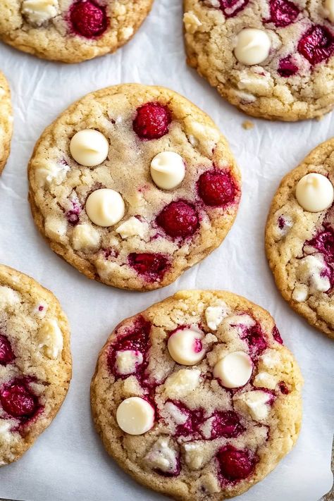 Featuring pops of vibrant fruit and rich, creamy chocolate, these white chocolate raspberry cookies are a delightful summer treat or year-round indulgence. White Chocolate Raspberry Cookies Recipe, White Chocolate Raspberry Pie, White Chocolate And Raspberry Cookies, White Chocolate Raspberry Cookies, Chocolate Raspberry Cookies, Raspberry White Chocolate Cookies, Raspberry Cookie Recipes, White Chocolate Macadamia Cookies, Raspberry Cheesecake Cookies