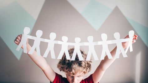 How to Make a Paper People Chain Cutout | HowStuffWorks Paper People Chain, Paper Doll Chain, Children Holding Hands, People Holding Hands, Girls Holding Hands, People Cutout, Cut Out People, Paper People, Paper Chains