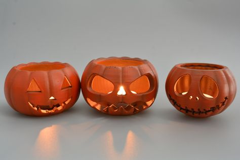 Inspired by Halloween - there are three different Jack O'Lantern pumpkin made with 3D printer. Every of them is painted by acrylic safety paints ;) To every figurine - one tea light is included. You can choose like one of the Jack O'Lantern pumpkins, but two or all of them by one click! Remember! Tea lights give very high temperature, so if you light a candle the cap must be removed to prevent it from melting. Only with LED candle tea light is possible to leave cap, when candle is lighting Pottery Jack O Lantern, Ceramic Jack O Lantern, Clay Jack O Lantern, Halloween Ceramics Ideas, Bathroom Design Rustic, Kitchen Design Vintage, Halloween Ceramics, Halloween Pottery, Halloween Candlesticks