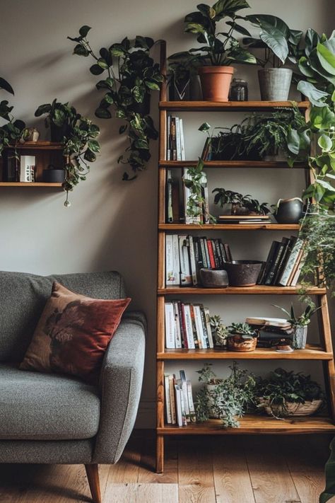 Build your own DIY ladder shelf for stylish and practical storage! A perfect addition to any room with a rustic or modern vibe. #DIYShelving #LadderShelf #HomeOrganization Display Ladder Shelf, Book Shelf Next To Tv, Book Plant Shelf, Living Room Ladder Shelves, Living Room Plant Shelf, Tall Shelves Living Room, Diy Standing Shelf, Diy Plant Shelf Indoor, Diy Wooden Bookshelf