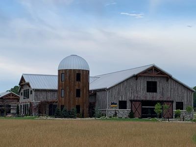 Crazy Critters Cabin - Barndominium | Barn-House | American Buildings Barndominium With Silo Ideas, Barndominium With Silo, Cabin Barndominium, Silo House, Grain Silo, Rock Climbing Wall, Farmhouse House, Standing Seam, Barn Style House