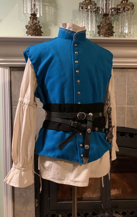 Blue Tunic Medieval, Blue Medieval Outfit Men, Fairytale Clothes Male, Light Blue Fantasy Outfit Male, Mens Rennaisance Faire Outfit, Jerkin For Men, Medevial Outfit, Blue Ren Faire Outfit, Fancy Medieval Clothes Male