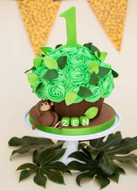 Jungle theme smash cake giant cupcake Jungle Theme Smash Cake First Birthdays, Smash Cake Jungle Theme, Jungle Themed Smash Cake, Safari Smash Cake 1st Birthdays, Jungle Theme Cake Smash, Jungle Smash Cake, Safari Smash Cake, Jungle Cake Smash, Monkey Smash Cake