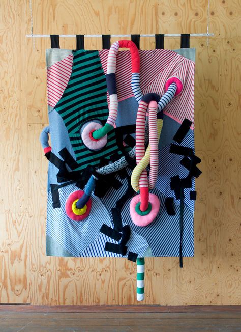 A colourful wall rug with 3 dimensional striped tubes is hanging in front of a wooden wall. Recycled Fabric Art, Couching Embroidery, Textiles Sketchbook, Fiber Art Projects, Me And My Family, Textile Art Embroidery, Textiles Artwork, Weaving Rug, Textile Sculpture